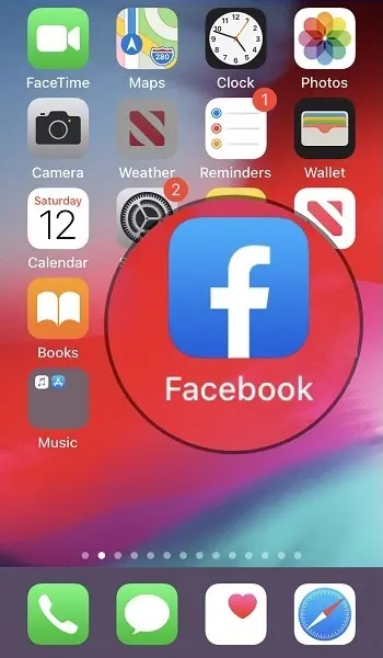 Facebook app icon highlighted on iPhone home screen