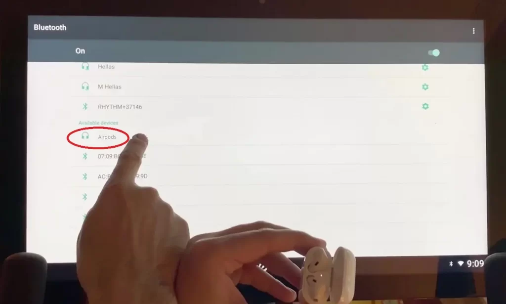 User clicking on his Airpods name to connect Peloton